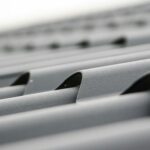 Detailed close-up of grey metal roof sheets showcasing texture and design.